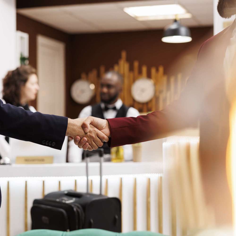 Employees agreeing on partnership, successful official international meeting at hotel. Business entrepreneurs shaking hands to start fruitful collaboration for company growth. Close up.